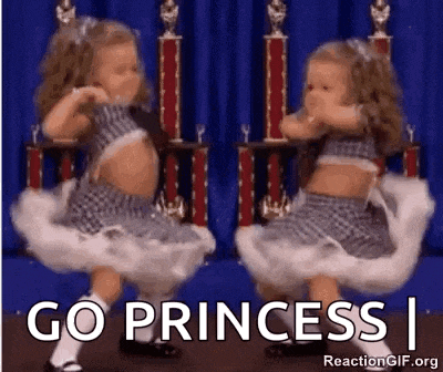 two little girls are dancing in front of trophies and the words `` go princess i '' .