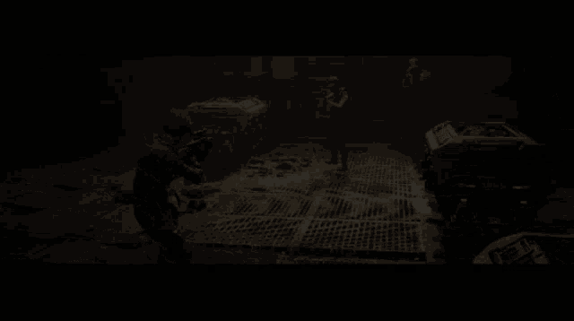 a blurred image of a person holding a gun in a room