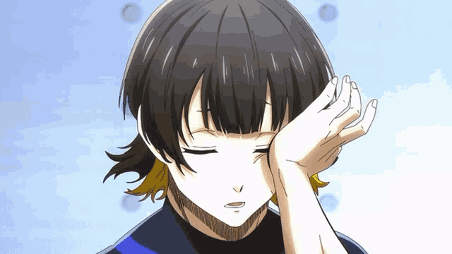 a person with their eyes closed and their hand on their head