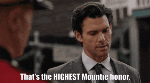 a man in a suit and tie says that 's the highest mountie honor