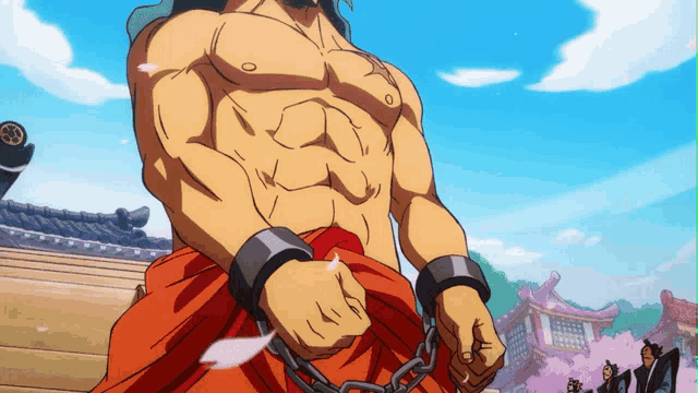 a shirtless man with chains around his waist stands in front of a building