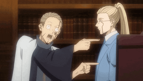 a man pointing at another man in front of a book shelf