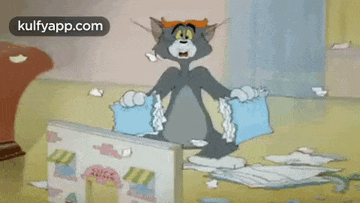 tom and jerry are flying through the air in a cartoon while fighting each other .