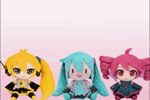 three stuffed anime characters are sitting next to each other