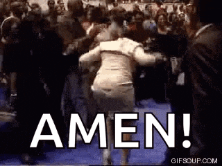 a woman is dancing in front of a crowd with the word amen written on the screen .