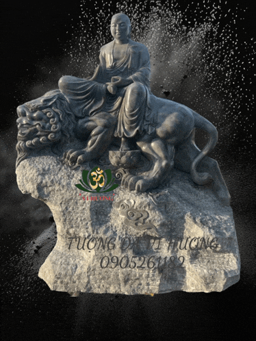 a statue of a man sitting on top of a lion with the number 30 in the background