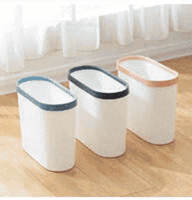 a white trash can with a blue rim and measurements on the side
