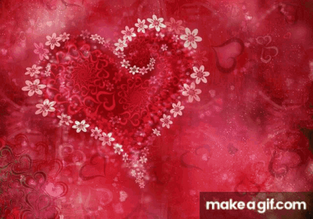 two hearts on a wooden surface with the words i love you written above them