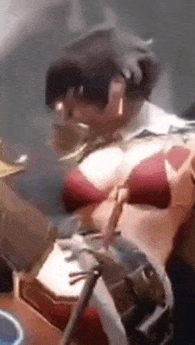 a close up of a person wearing a helmet and a red bikini .