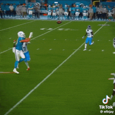 a group of football players on a field with one wearing a jersey that says avery