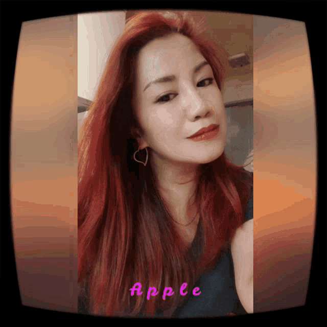 a picture of a woman with red hair and the word apple