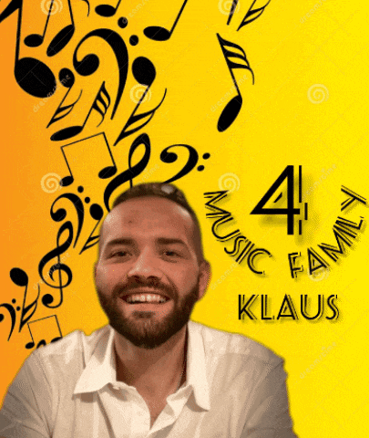 a man with a beard is smiling in front of a yellow background with music notes