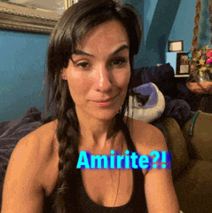 a woman sitting on a couch with the words amirite written on her chest