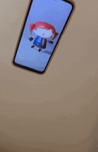 a cell phone is floating in the air on a wall