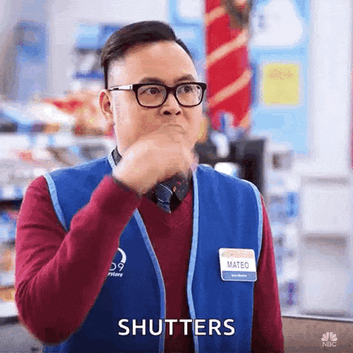 a man wearing glasses and a name tag that says mateo on it