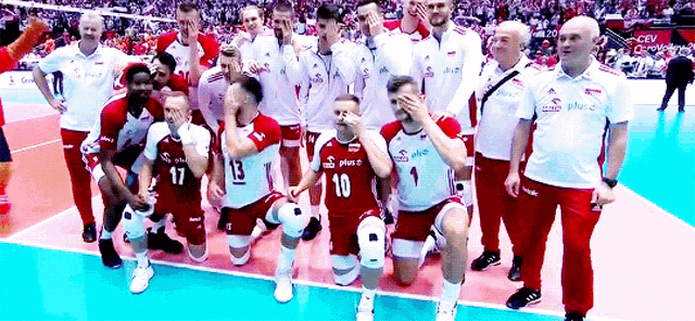 a group of volleyball players are posing for a picture and one of them has the number 10 on his jersey