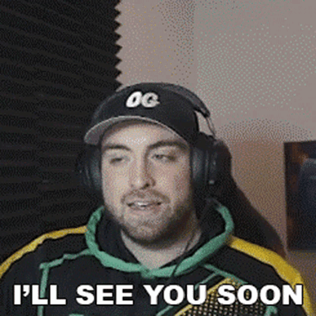 a man wearing headphones and a hat is smiling and says `` i 'll see you soon '' .