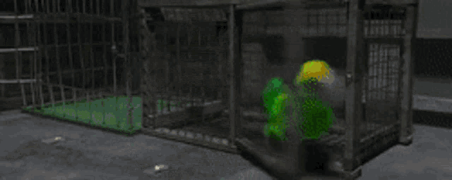 a green worm is crawling out of a cage