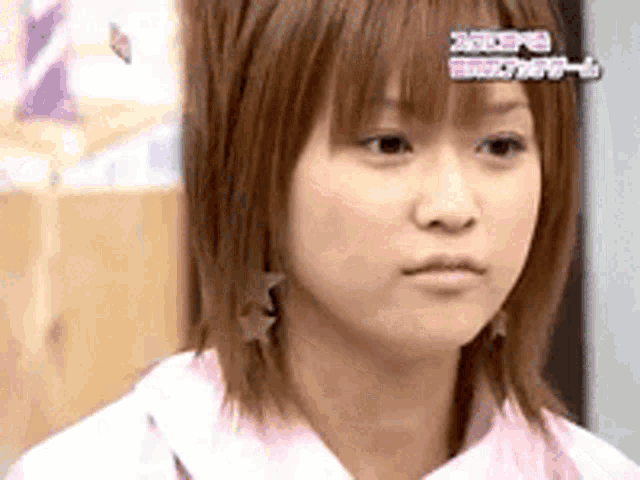 a close up of a woman 's face with the word tokyo on the bottom right corner