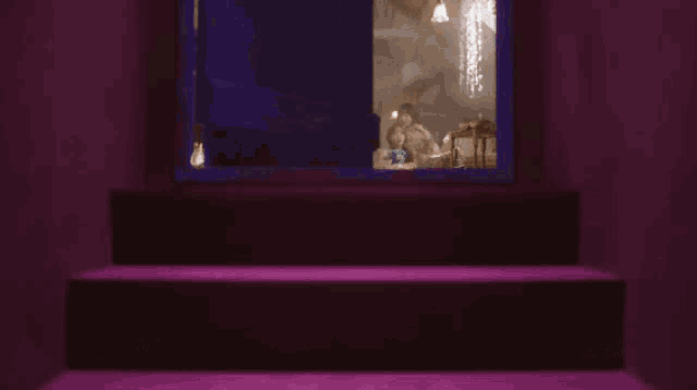 a group of women are sitting in an attic with a wicker chair