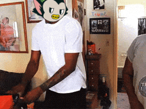 a man in a white shirt has a mask on his head that looks like a cat