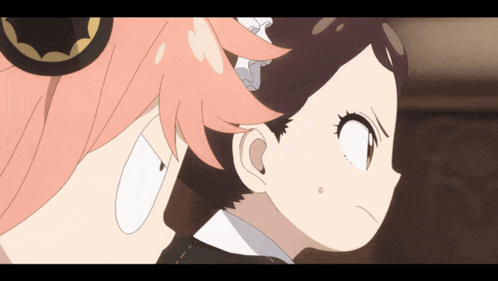 a girl with pink hair stands next to another girl with black hair