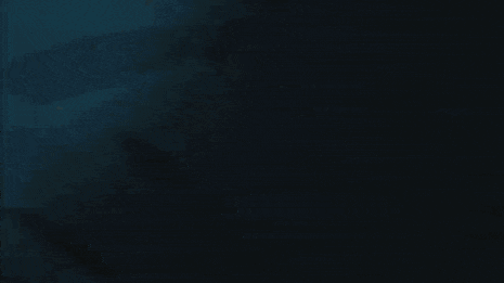 a person is holding a sword in front of a blue glowing monster