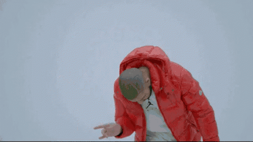 two women are dancing in front of a green screen