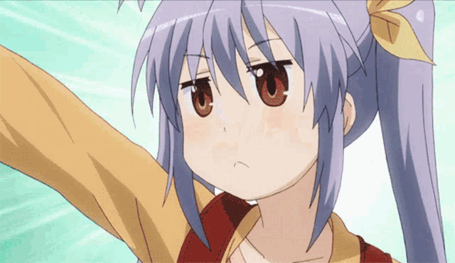 a girl with purple hair and brown eyes is making a face