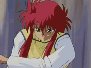 a cartoon character with red hair and green eyes is standing in front of a curtain .