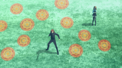 a man and a woman are standing in a grassy field