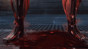 a video game character 's legs are shown with blood on the ground