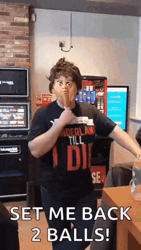 a man wearing a shirt that says ' i 'll die ' on it is making a funny face