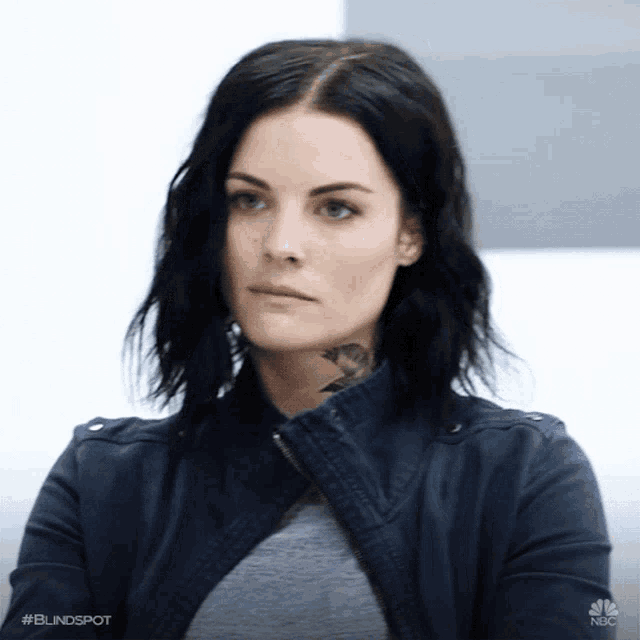 a close up of a woman 's face with the words #blindspot on the bottom