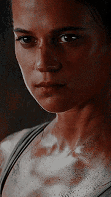 a close up of a woman 's face with white spots on her skin
