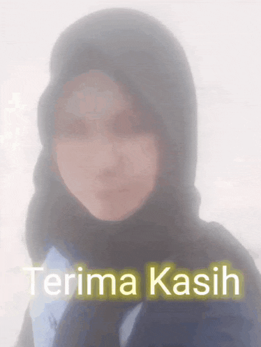 a blurred image of a woman wearing a hijab with the words terima kasih written below her