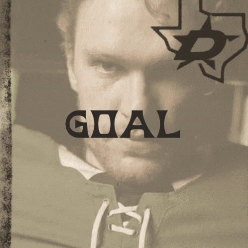 a man 's face is behind the word goal in black letters
