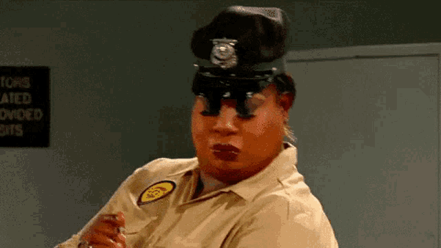 a woman in a police uniform has a badge that says ncs on it