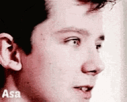 a close up of a man 's face with the word asa on the bottom .