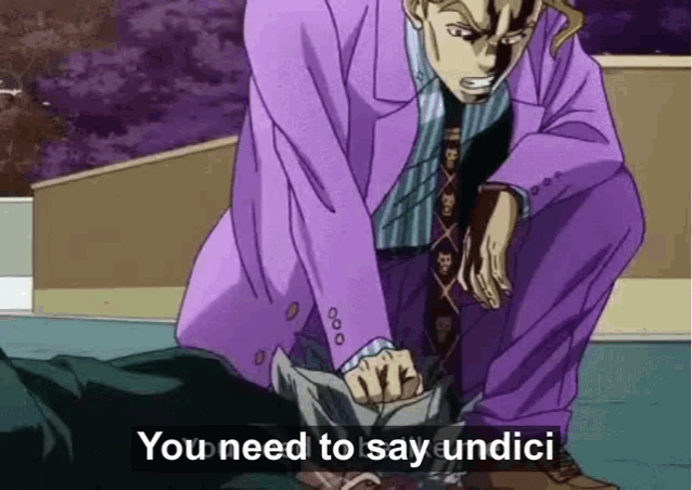 a man in a purple suit and tie is squatting down next to a person laying on the ground .