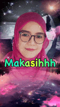 a woman wearing glasses and a pink hijab has the word makasihhh written on her face