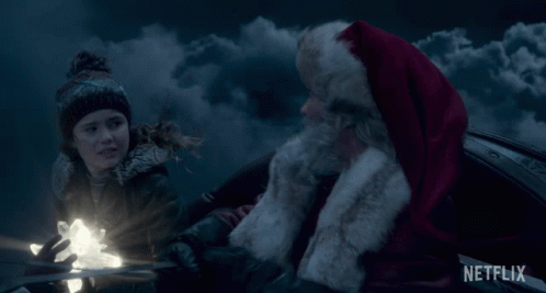 High Five Santa Claus GIF - High Five Santa Claus Kurt Russell GIFs