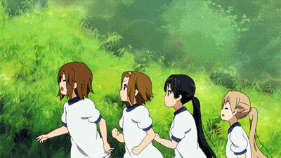 a group of anime girls running through a grassy field
