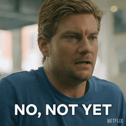 a man in a blue shirt with the words no not yet on the bottom