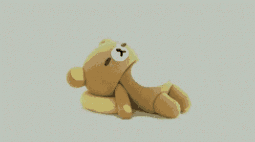 a brown teddy bear with a white x on its face