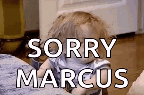 a baby is sitting at a table with the words sorry marcus written on it .