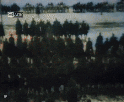 a blurry picture of people riding horses with the letters 24 ack visible