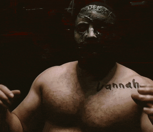 a man with a mask on has the word vanna written on his chest