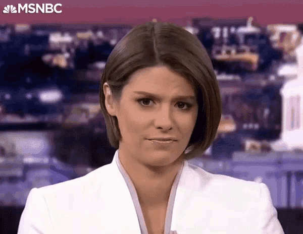 a female news anchor is making a funny face while standing in front of a msnbc logo .
