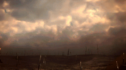 a cloudy sky over a field with swords in it